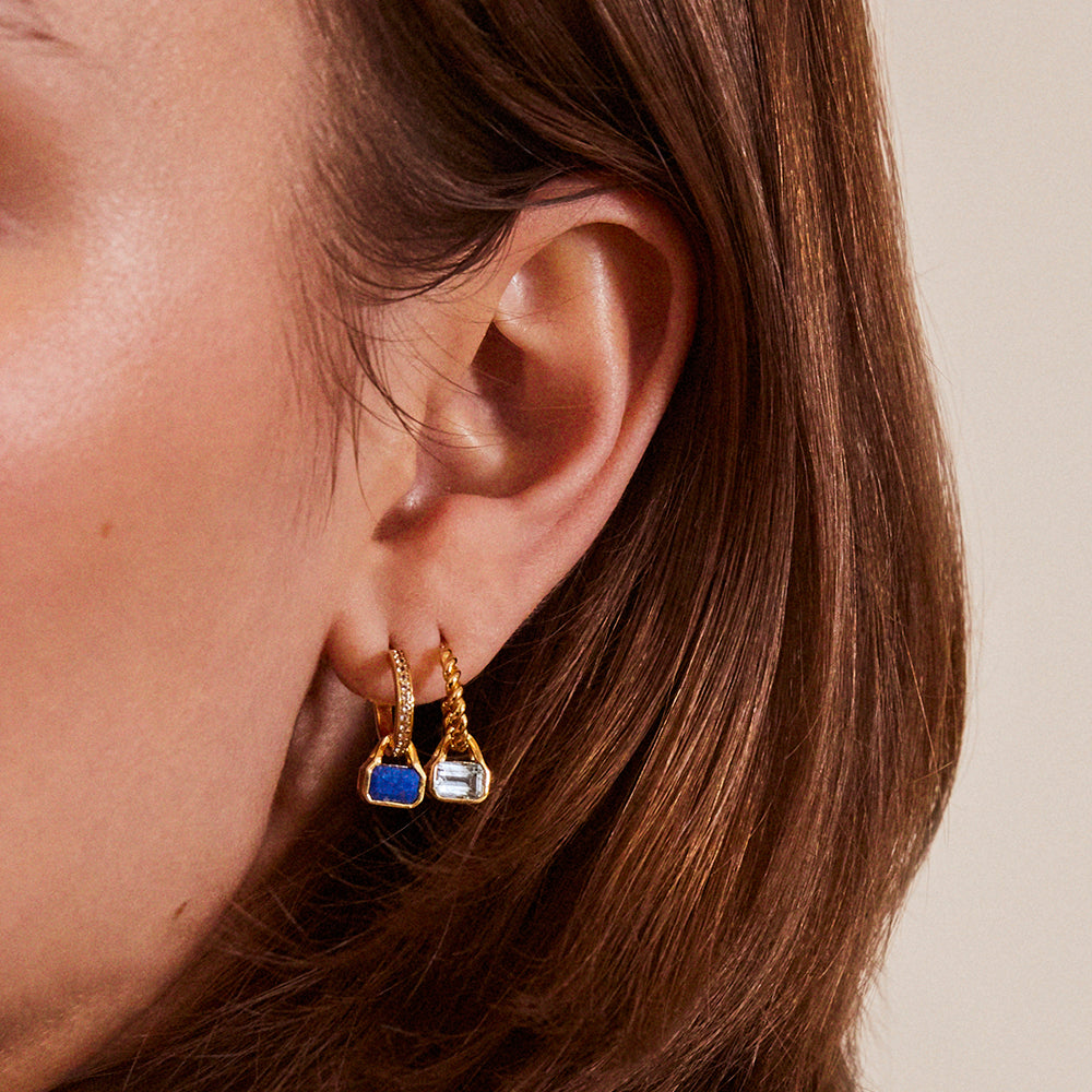March: Blue Topaz Charms on Twisted Hoops
