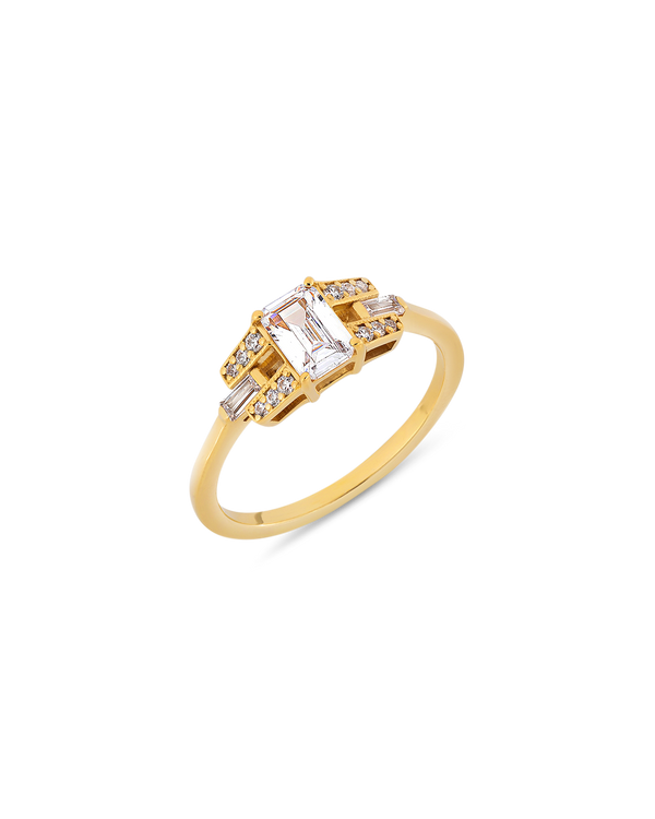 Emerald cut diamond buckle ring in yellow gold