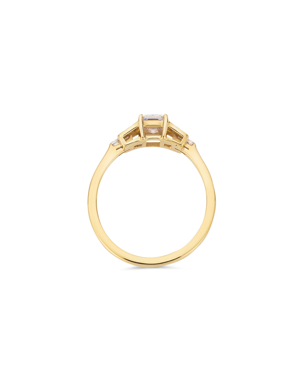 Emerald cut diamond buckle ring in yellow gold