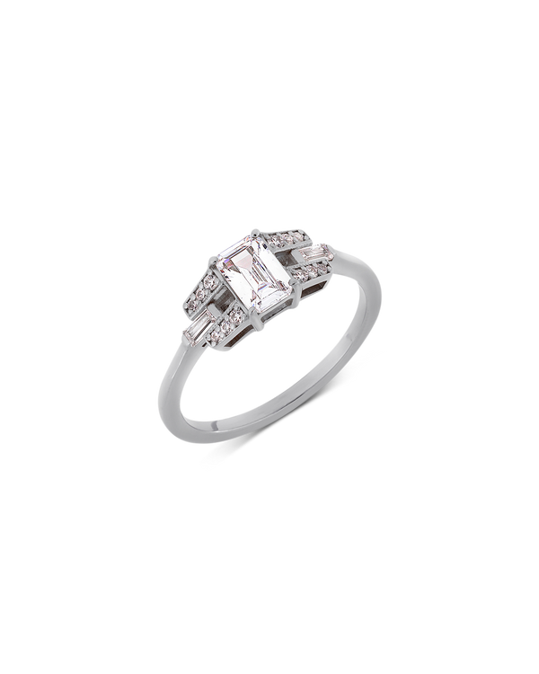 Emerald cut diamond buckle ring in platinum