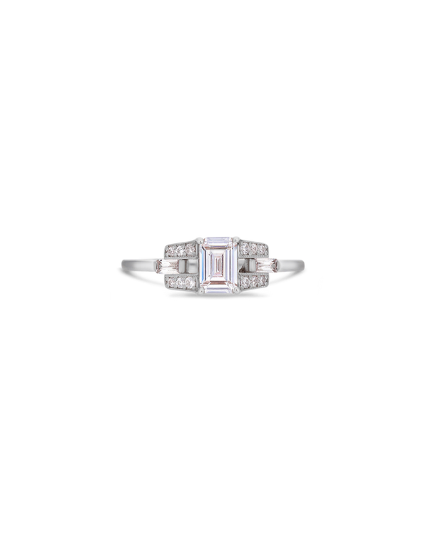 Emerald cut diamond buckle ring in platinum