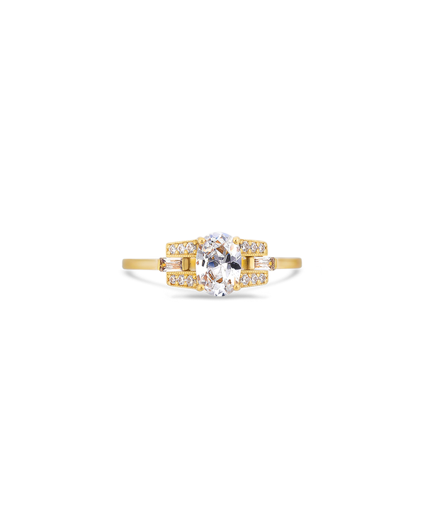 Oval cut diamond buckle ring in yellow gold