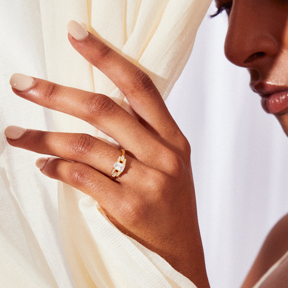 Emerald cut diamond buckle ring in platinum engagement ring v by laura vann