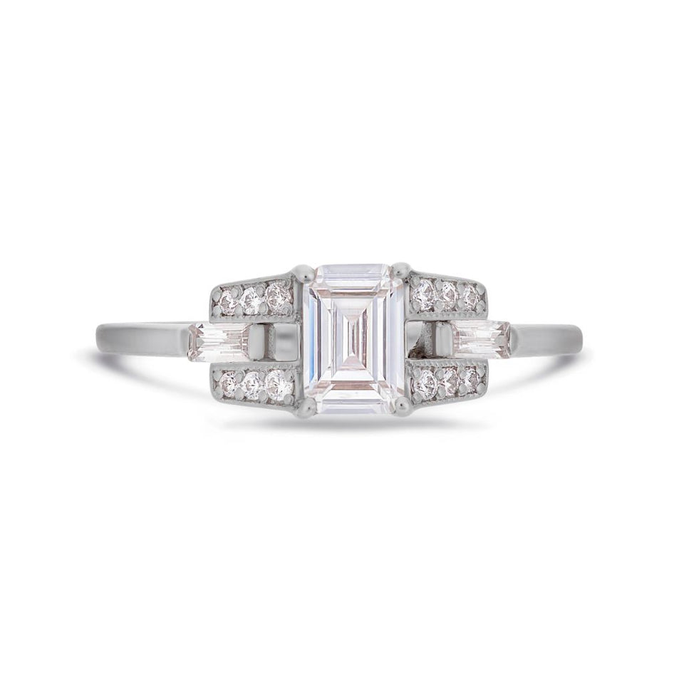 Emerald cut buckle diamond ring in white gold