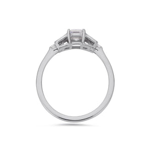 Emerald cut diamond buckle ring in platinum